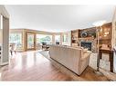 184 Scenic Hill Close Nw, Calgary, AB  - Indoor Photo Showing Living Room With Fireplace 