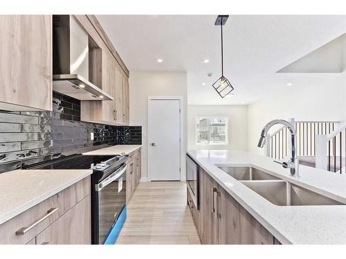 342 Midgrove Link Sw, Airdrie, AB - Indoor Photo Showing Kitchen With Double Sink With Upgraded Kitchen