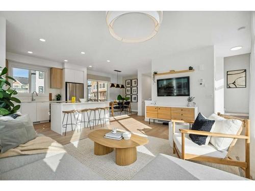 3957 Quesnay Wood Drive Sw, Calgary, AB - Indoor Photo Showing Living Room