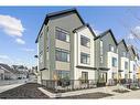 3957 Quesnay Wood Drive Sw, Calgary, AB  - Outdoor With Facade 