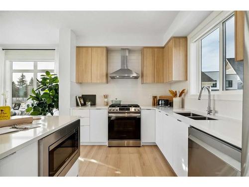 3957 Quesnay Wood Drive Sw, Calgary, AB - Indoor Photo Showing Kitchen With Double Sink