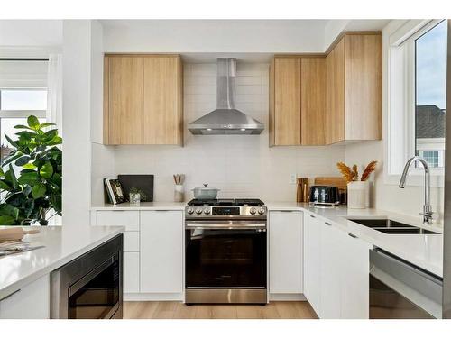 3957 Quesnay Wood Drive Sw, Calgary, AB - Indoor Photo Showing Kitchen With Double Sink With Upgraded Kitchen