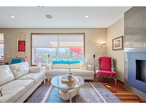 26 Quarry Point Se, Calgary, AB - Indoor Photo Showing Living Room With Fireplace