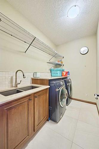 26 Quarry Point Se, Calgary, AB - Indoor Photo Showing Laundry Room