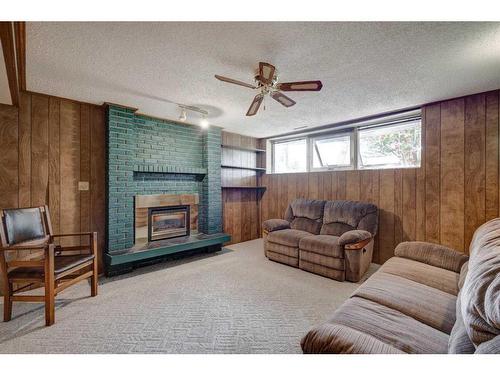 9440 Academy Drive Se, Calgary, AB - Indoor Photo Showing Living Room With Fireplace