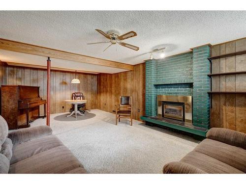 9440 Academy Drive Se, Calgary, AB - Indoor Photo Showing Living Room With Fireplace