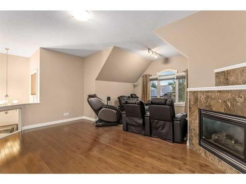 1733 Evergreen Drive Sw, Calgary, AB - Indoor Photo Showing Living Room With Fireplace