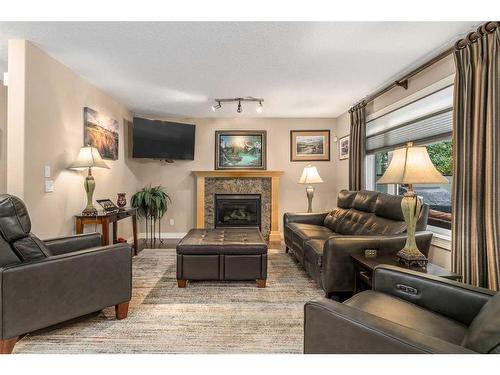 1733 Evergreen Drive Sw, Calgary, AB - Indoor Photo Showing Living Room With Fireplace