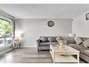 11 Falchurch Road Ne, Calgary, AB  - Indoor Photo Showing Living Room 