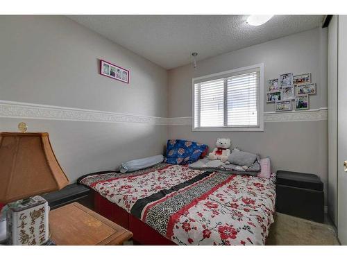 807 Erin Woods Drive Se, Calgary, AB - Indoor Photo Showing Bedroom