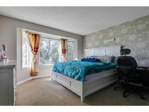 807 Erin Woods Drive Se, Calgary, AB - Indoor Photo Showing Bedroom