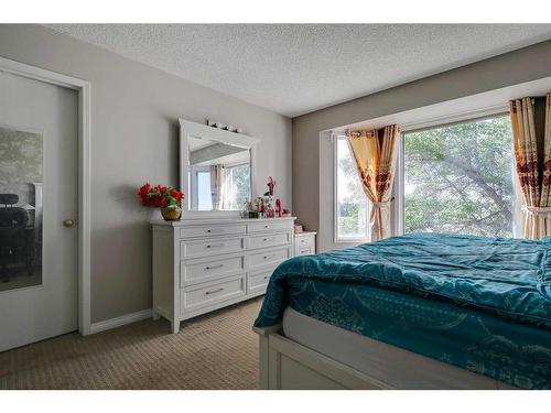 807 Erin Woods Drive Se, Calgary, AB - Indoor Photo Showing Bedroom