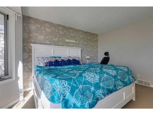 807 Erin Woods Drive Se, Calgary, AB - Indoor Photo Showing Bedroom