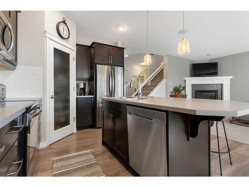 47 Sunset Terrace, Cochrane, AB - Indoor Photo Showing Kitchen With Stainless Steel Kitchen With Upgraded Kitchen