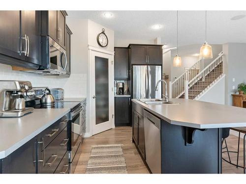 47 Sunset Terrace, Cochrane, AB - Indoor Photo Showing Kitchen With Stainless Steel Kitchen With Upgraded Kitchen