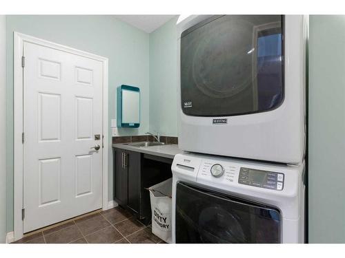 47 Sunset Terrace, Cochrane, AB - Indoor Photo Showing Laundry Room