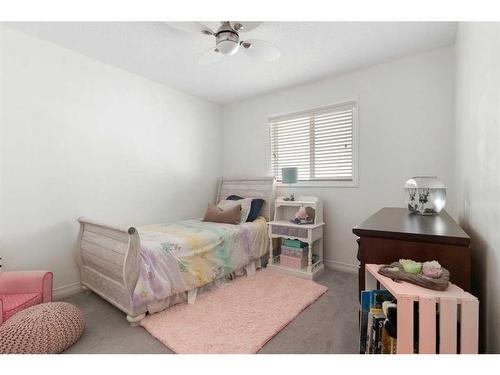 47 Sunset Terrace, Cochrane, AB - Indoor Photo Showing Bedroom