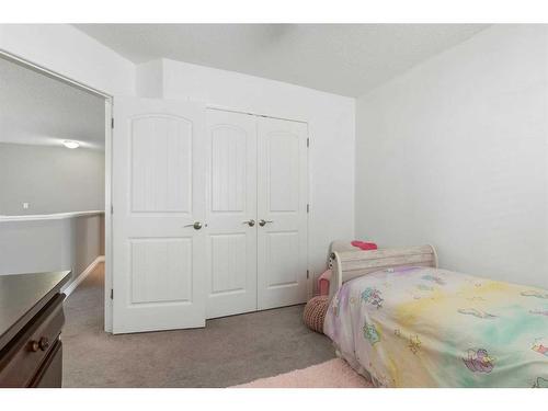 47 Sunset Terrace, Cochrane, AB - Indoor Photo Showing Bedroom