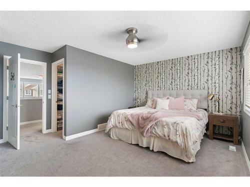 47 Sunset Terrace, Cochrane, AB - Indoor Photo Showing Bedroom