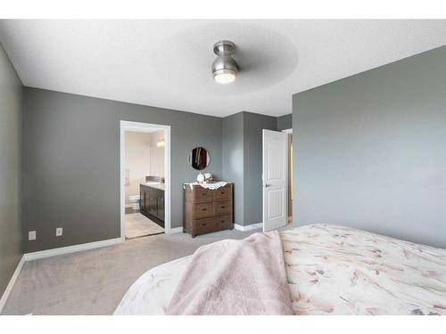 47 Sunset Terrace, Cochrane, AB - Indoor Photo Showing Bedroom