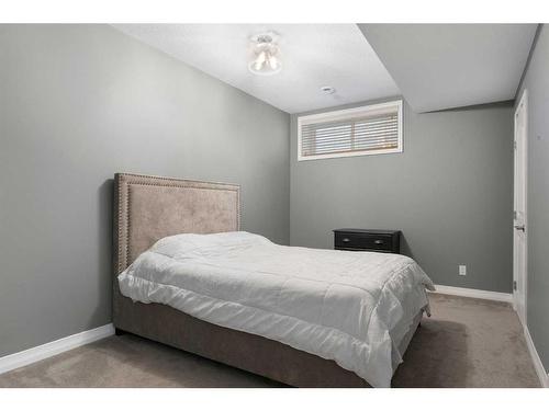 47 Sunset Terrace, Cochrane, AB - Indoor Photo Showing Bedroom