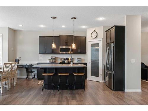 47 Sunset Terrace, Cochrane, AB - Indoor Photo Showing Kitchen With Stainless Steel Kitchen With Upgraded Kitchen