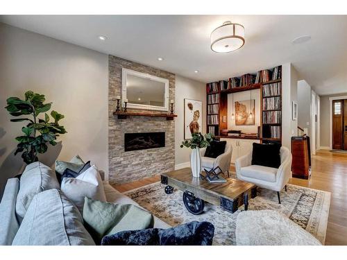 1215 15 Street Se, Calgary, AB - Indoor Photo Showing Living Room With Fireplace