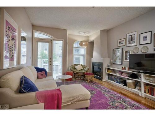 103-1026 12 Avenue Sw, Calgary, AB - Indoor Photo Showing Living Room With Fireplace