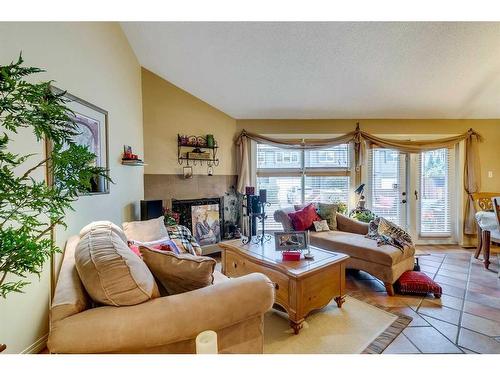 52-2225 Oakmoor Drive Sw, Calgary, AB - Indoor Photo Showing Living Room With Fireplace