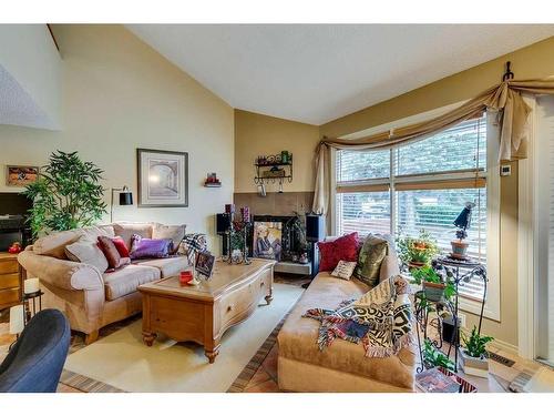 52-2225 Oakmoor Drive Sw, Calgary, AB - Indoor Photo Showing Living Room With Fireplace