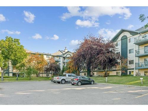 201-10 Dover Point Se, Calgary, AB - Outdoor With Balcony With Facade