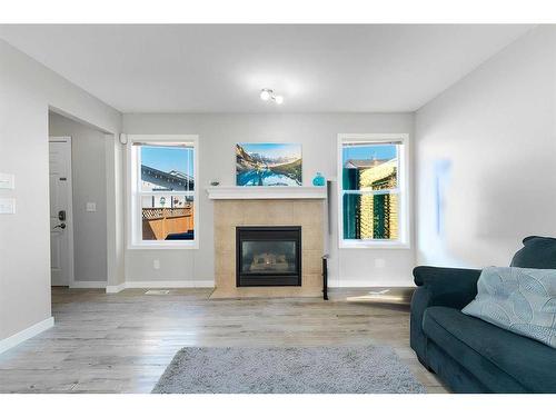 219 Covemeadow Crescent Ne, Calgary, AB - Indoor Photo Showing Living Room With Fireplace