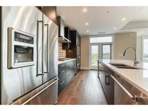 302-33 Burma Star Road Sw, Calgary, AB - Indoor Photo Showing Kitchen With Stainless Steel Kitchen With Double Sink With Upgraded Kitchen