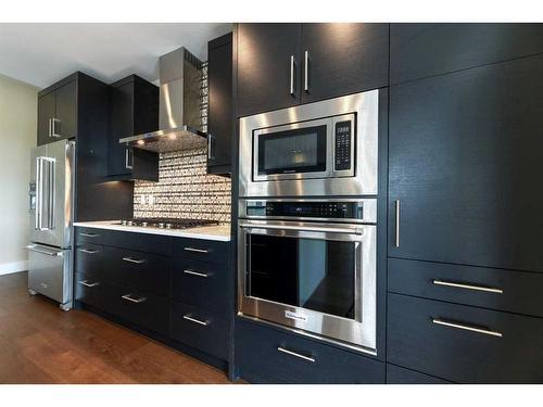 302-33 Burma Star Road Sw, Calgary, AB - Indoor Photo Showing Kitchen With Stainless Steel Kitchen With Upgraded Kitchen