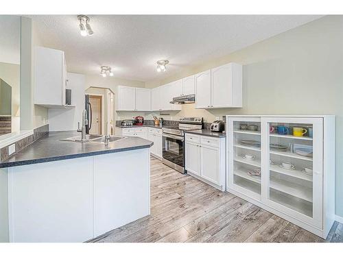 216 Cougar Ridge Drive Sw, Calgary, AB - Indoor Photo Showing Kitchen With Double Sink