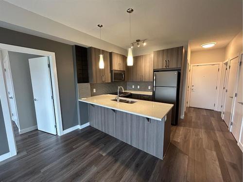 320-16 Sage Hill Terrace Nw, Calgary, AB - Indoor Photo Showing Kitchen With Double Sink