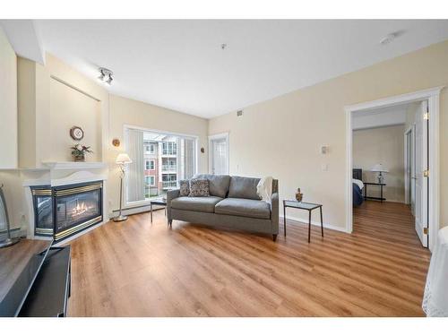 274-223 Tuscany Springs Boulevard Nw, Calgary, AB - Indoor Photo Showing Living Room With Fireplace