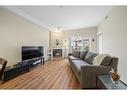 274-223 Tuscany Springs Boulevard Nw, Calgary, AB  - Indoor Photo Showing Living Room With Fireplace 