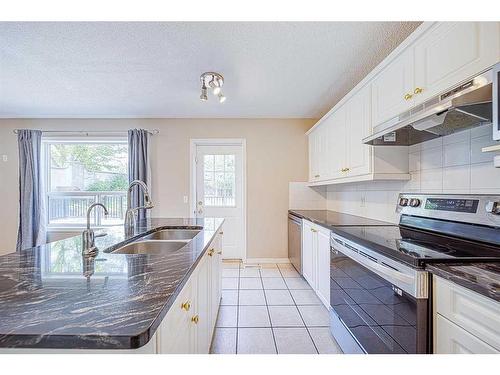 1 Valley Creek Road Nw, Calgary, AB - Indoor Photo Showing Kitchen With Double Sink