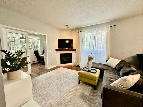 118-126 14 Avenue Sw, Calgary, AB - Indoor Photo Showing Living Room With Fireplace