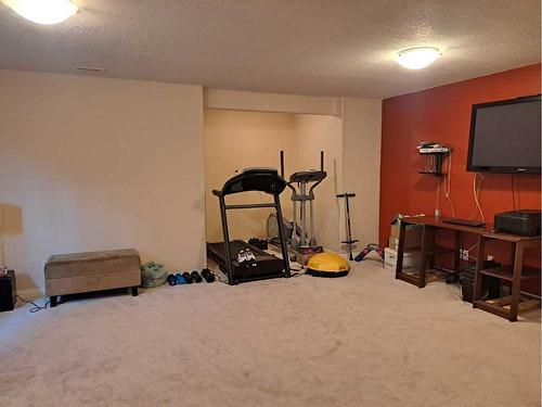 383 Everglade Circle Sw, Calgary, AB - Indoor Photo Showing Gym Room