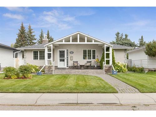 84 Hollyburn Road Sw, Calgary, AB - Outdoor With Deck Patio Veranda