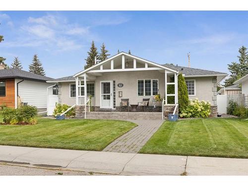 84 Hollyburn Road Sw, Calgary, AB - Outdoor With Deck Patio Veranda With Facade