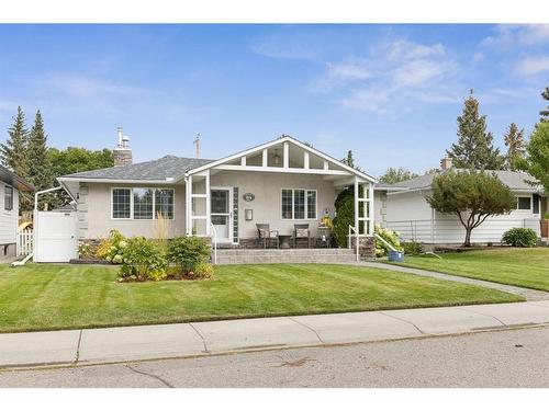 84 Hollyburn Road Sw, Calgary, AB - Outdoor With Deck Patio Veranda With Facade