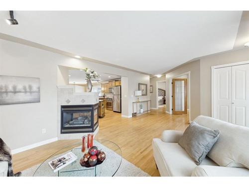 84 Hollyburn Road Sw, Calgary, AB - Indoor Photo Showing Living Room With Fireplace