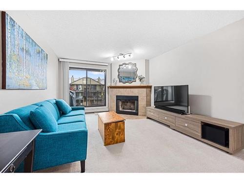 2310-13045 6 Street Sw, Calgary, AB - Indoor Photo Showing Living Room With Fireplace