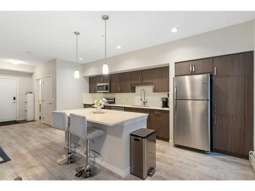 210-7 Westpark Common Sw, Calgary, AB - Indoor Photo Showing Kitchen With Stainless Steel Kitchen With Upgraded Kitchen