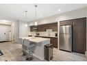 210-7 Westpark Common Sw, Calgary, AB  - Indoor Photo Showing Kitchen With Stainless Steel Kitchen With Upgraded Kitchen 