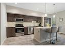 210-7 Westpark Common Sw, Calgary, AB  - Indoor Photo Showing Kitchen With Stainless Steel Kitchen With Upgraded Kitchen 