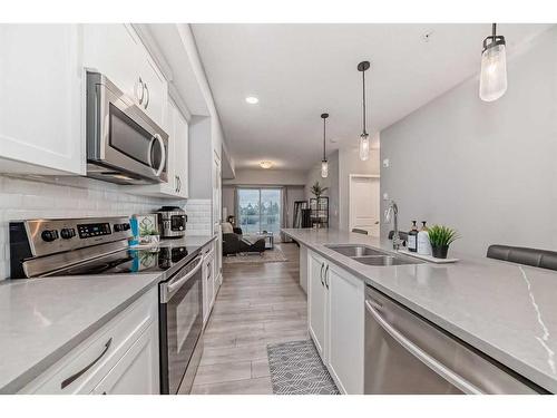 303-360 Harvest Hills Common Ne, Calgary, AB - Indoor Photo Showing Kitchen With Stainless Steel Kitchen With Double Sink With Upgraded Kitchen